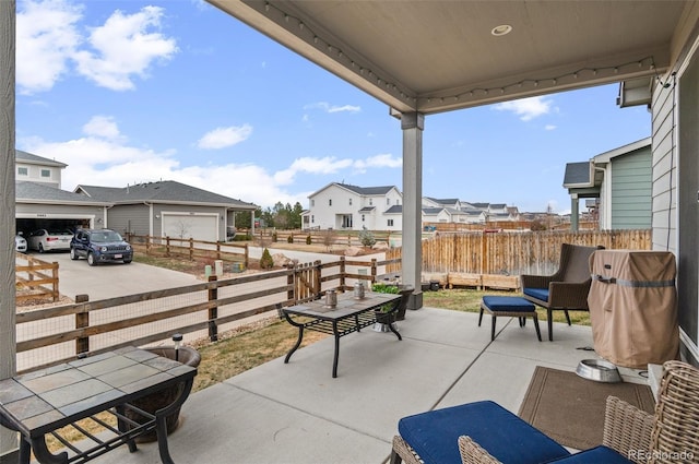 9883 Truckee St, Commerce City, CO 80022 - view of patio / terrace with fence and a residential view