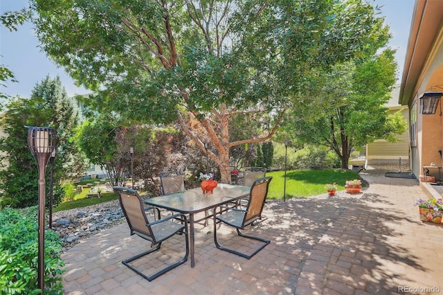 8582 E 148th Ln, Thornton, CO 80602 - view of patio / terrace featuring outdoor dining area