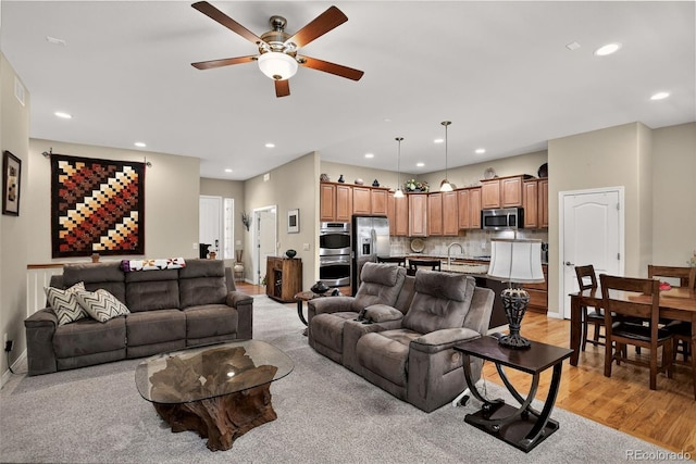 8582 E 148th Ln, Thornton, CO 80602 - living room with a ceiling fan, light wood-type flooring, and recessed lighting