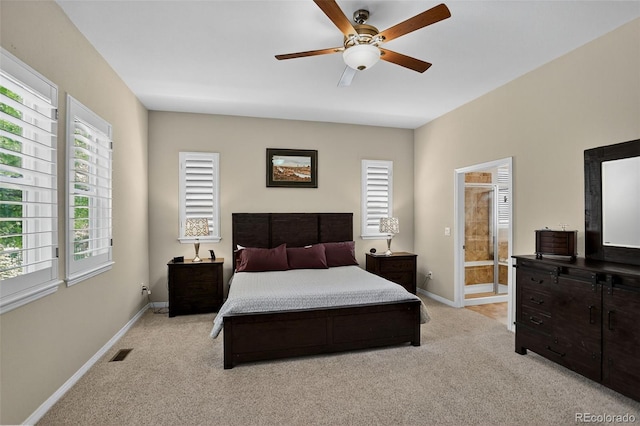 8582 E 148th Ln, Thornton, CO 80602 - bedroom featuring light colored carpet, ensuite bath, and ceiling fan