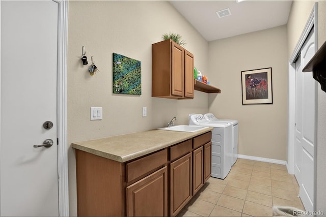 8582 E 148th Ln, Thornton, CO 80602 - laundry area featuring cabinet space, washer and clothes dryer, and light tile patterned floors