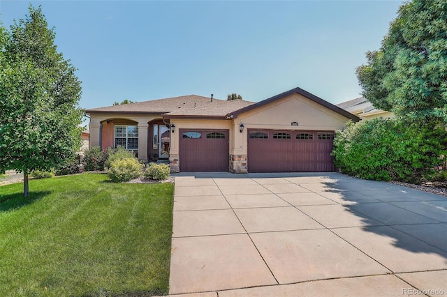 8582 E 148th Ln, Thornton, CO 80602 - ranch-style house featuring stucco siding, an attached garage, a front lawn, driveway, and stone siding