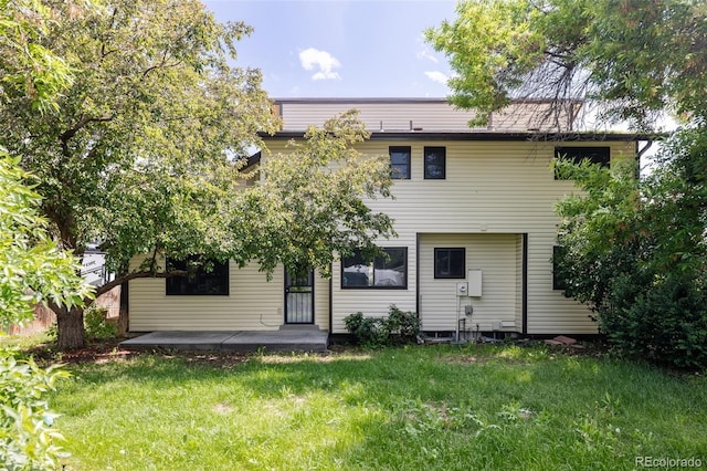 7231 Eaton Cir, Arvada, CO 80003 - back of house featuring a yard