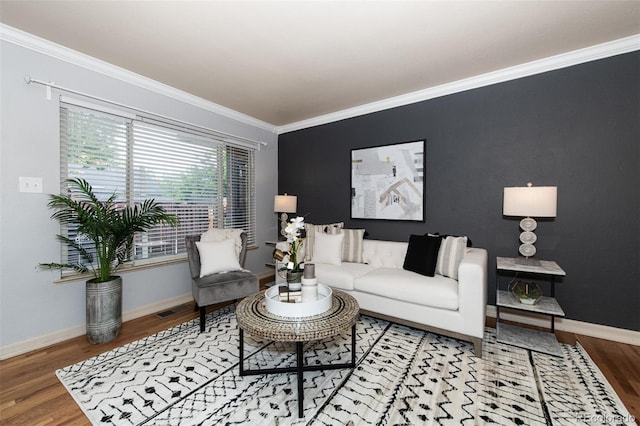 living room featuring crown molding and hardwood / wood-style floors