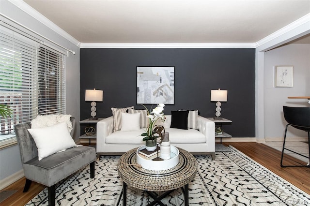 living room featuring wood-type flooring and ornamental molding