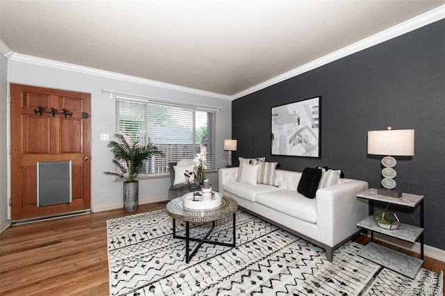 living room with light hardwood / wood-style flooring and ornamental molding