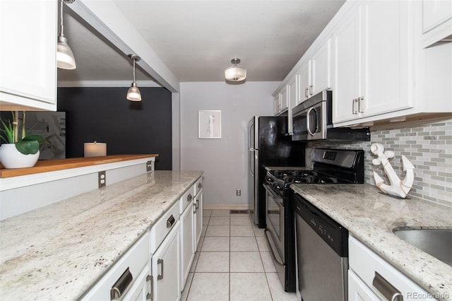 kitchen with backsplash, white cabinets, ornamental molding, decorative light fixtures, and stainless steel appliances