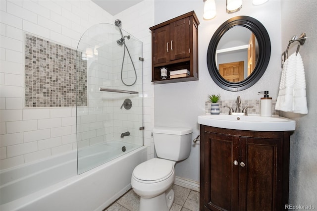 full bathroom featuring toilet, vanity, tile patterned floors, and tiled shower / bath combo