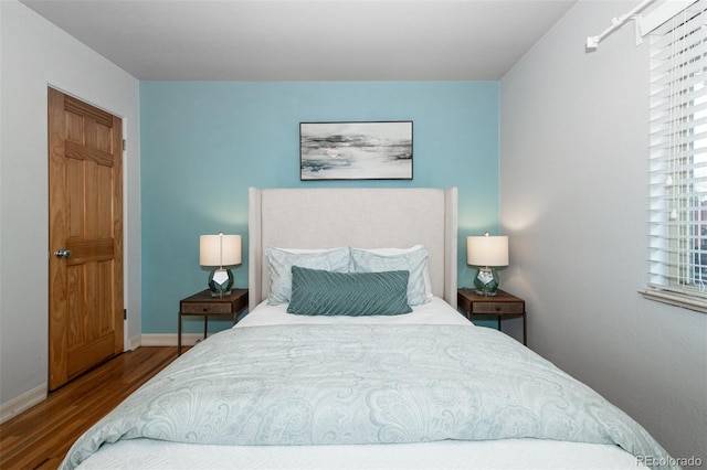 bedroom with hardwood / wood-style floors