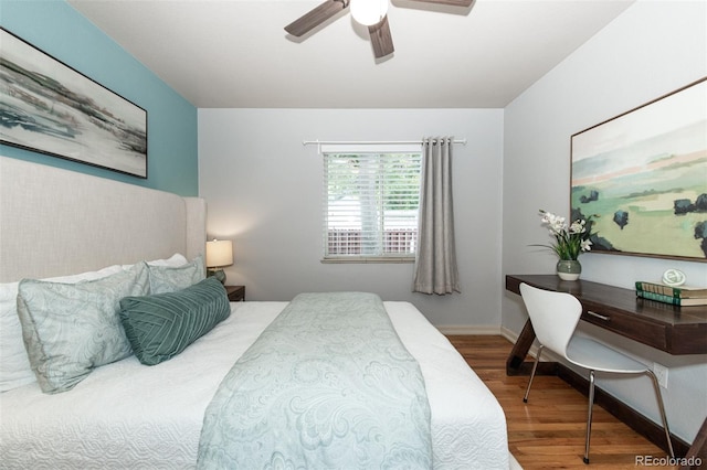 bedroom with hardwood / wood-style flooring and ceiling fan