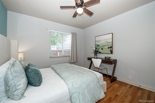 bedroom featuring hardwood / wood-style floors and ceiling fan