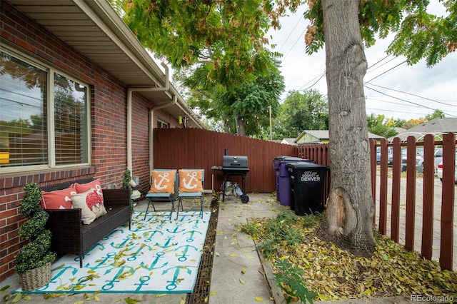 view of patio featuring a grill