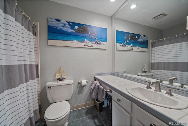 bathroom featuring toilet, a shower with shower curtain, vanity, and tile patterned flooring