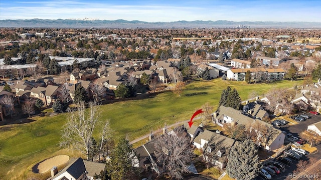 birds eye view of property with a mountain view