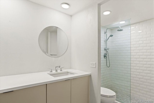 550 E 12th Ave Unit 209, Denver, CO 80203 - full bathroom featuring vanity, walk in shower, and toilet