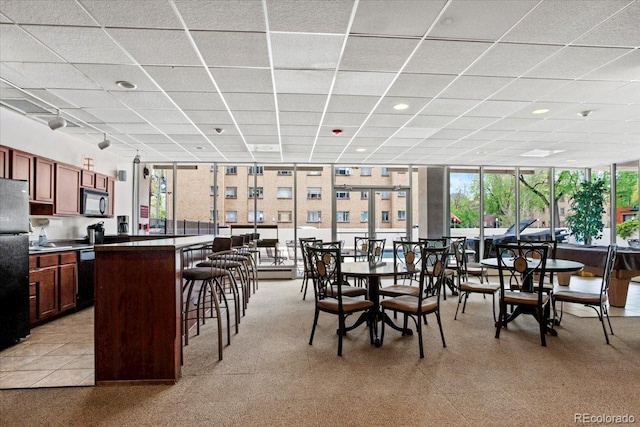 550 E 12th Ave Unit 209, Denver, CO 80203 - dining area featuring a drop ceiling