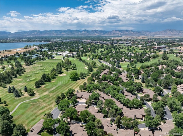 drone / aerial view with a water and mountain view