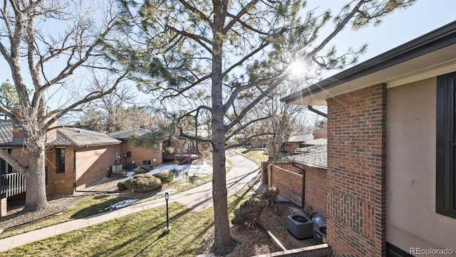 view of yard with central AC unit