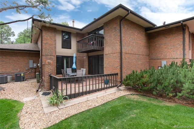 back of house featuring central air condition unit and a patio area