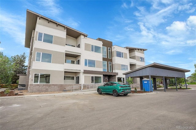 1304 Snowberry Unit 103, Louisville, CO 80027 - view of building exterior featuring uncovered parking