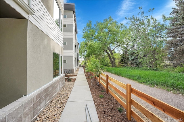 1304 Snowberry Unit 103, Louisville, CO 80027 - view of home's exterior featuring stucco siding and fence