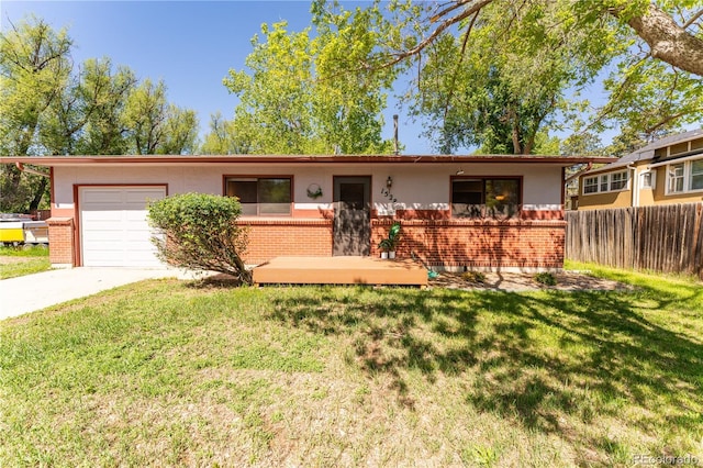 1528 N Chestnut St, Colorado Springs, CO 80907 - ranch-style home with brick siding, a garage, driveway, and stucco siding