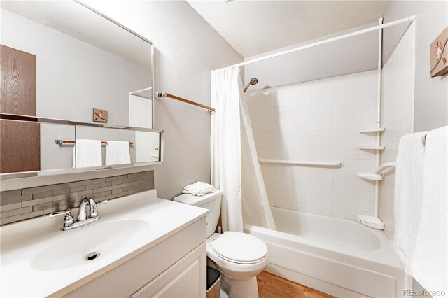 1528 N Chestnut St, Colorado Springs, CO 80907 - bathroom with shower / tub combo, vanity, toilet, tasteful backsplash, and wood finished floors