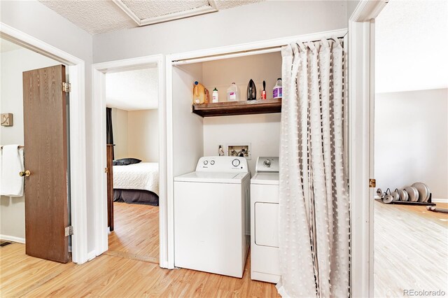 1528 N Chestnut St, Colorado Springs, CO 80907 - washroom with independent washer and dryer, light wood-type flooring, and baseboards