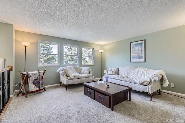 living room featuring carpet flooring and a textured ceiling