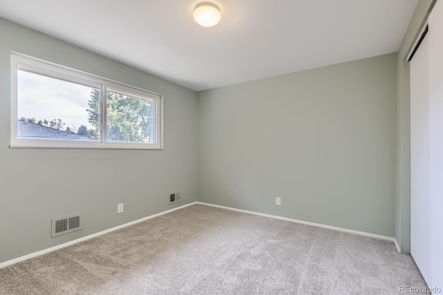 unfurnished room with carpet