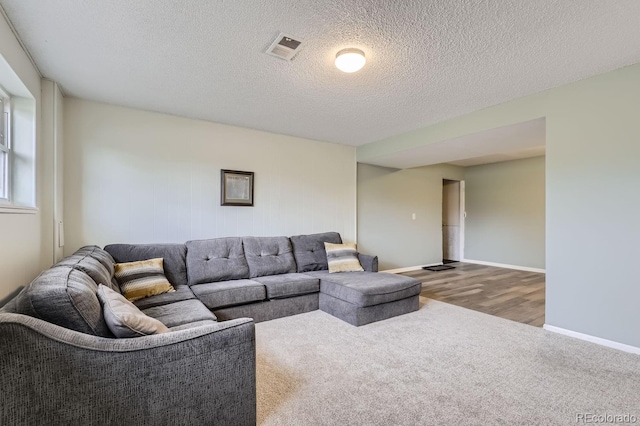 living room with a textured ceiling