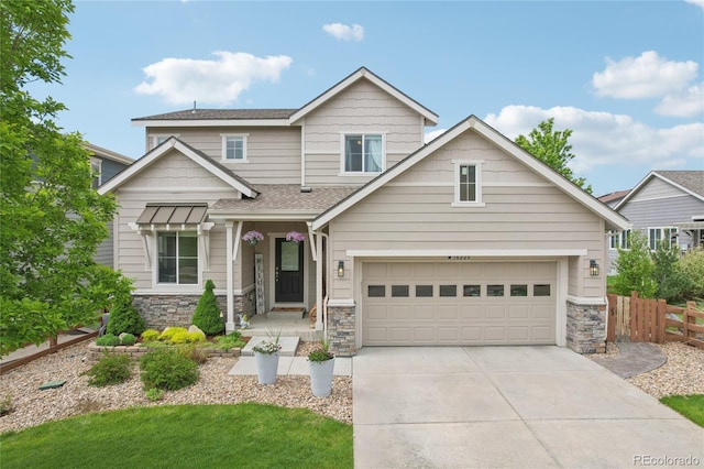 16226 W 94th Dr, Arvada, CO 80007 - view of front of house featuring driveway, stone siding, and a shingled roof