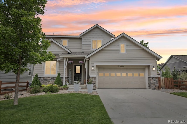 16226 W 94th Dr, Arvada, CO 80007 - view of front facade with stone siding, driveway, and a garage