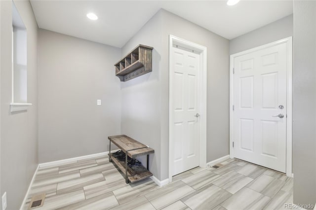 16226 W 94th Dr, Arvada, CO 80007 - hall with recessed lighting, baseboards, and wood tiled floors