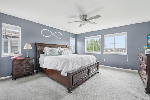 16226 W 94th Dr, Arvada, CO 80007 - bedroom with multiple windows, light colored carpet, baseboards, and ceiling fan