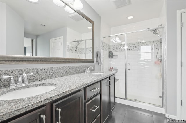 16226 W 94th Dr, Arvada, CO 80007 - full bathroom with a shower stall, tile patterned floors, double vanity, and recessed lighting