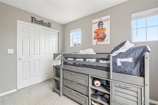 16226 W 94th Dr, Arvada, CO 80007 - carpeted bedroom with a closet and baseboards