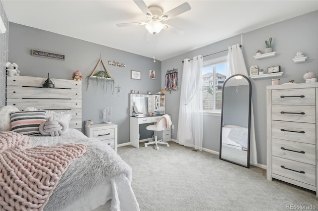 16226 W 94th Dr, Arvada, CO 80007 - bedroom featuring light colored carpet, baseboards, an office area, and a ceiling fan
