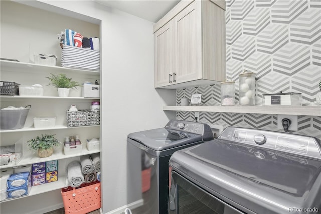 16226 W 94th Dr, Arvada, CO 80007 - washroom with washer and clothes dryer and cabinet space