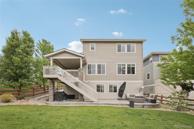 16226 W 94th Dr, Arvada, CO 80007 - back of house with stairway, a patio, and an outdoor living space