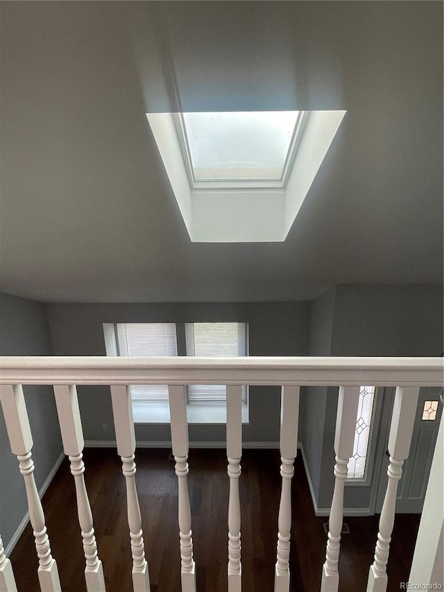 14503 E Wagon Trail Dr, Aurora, CO 80015 - stairway featuring wood finished floors and baseboards