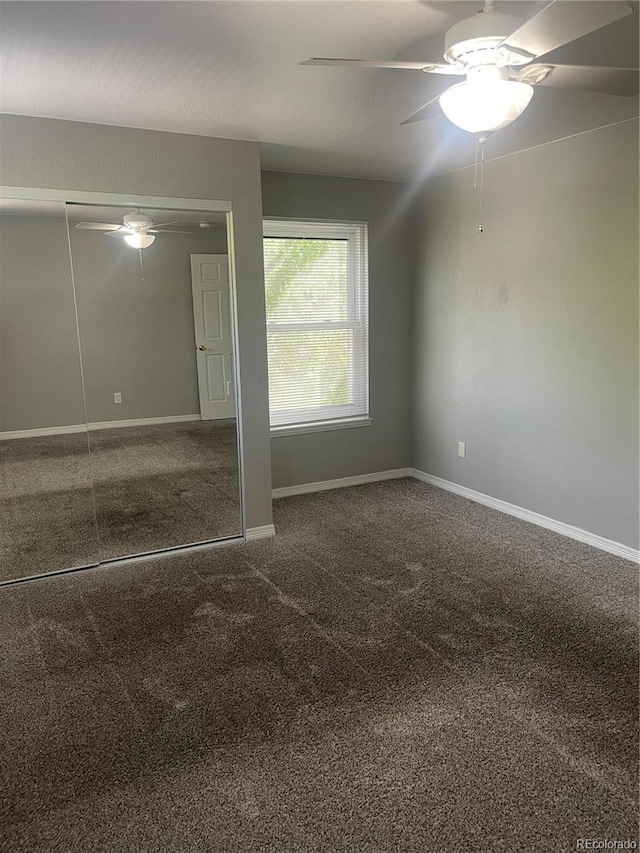 14503 E Wagon Trail Dr, Aurora, CO 80015 - spare room with a ceiling fan, carpet flooring, and baseboards