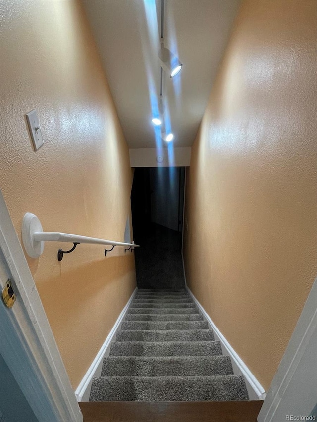 14503 E Wagon Trail Dr, Aurora, CO 80015 - stairs featuring baseboards, carpet floors, and a textured wall