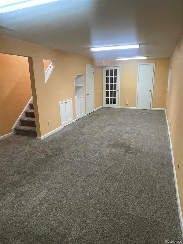 14503 E Wagon Trail Dr, Aurora, CO 80015 - carpeted spare room featuring stairs and baseboards