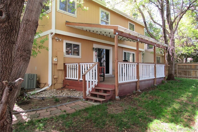 14503 E Wagon Trail Dr, Aurora, CO 80015 - rear view of property with cooling unit and a deck