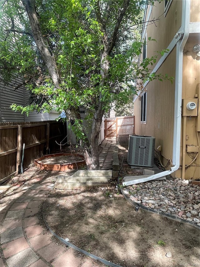 14503 E Wagon Trail Dr, Aurora, CO 80015 - fenced backyard with central AC unit and a patio