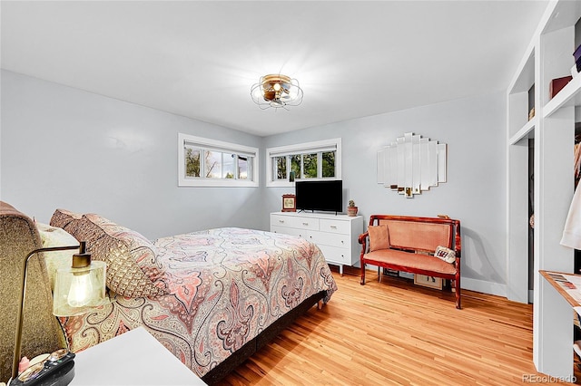 2201 Lima St, Aurora, CO 80010 - bedroom with light wood-style floors and baseboards