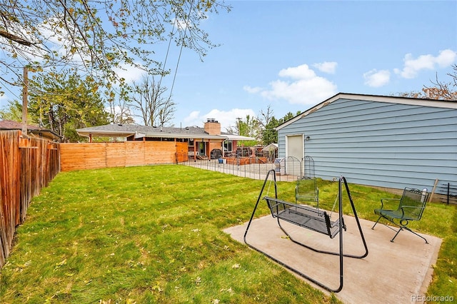 2201 Lima St, Aurora, CO 80010 - view of yard featuring a fenced backyard and a patio