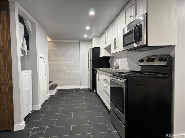 2201 Lima St, Aurora, CO 80010 - kitchen with a sink, stainless steel appliances, visible vents, recessed lighting, and white cabinets