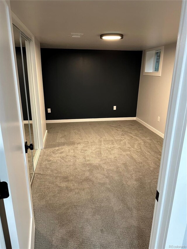 2201 Lima St, Aurora, CO 80010 - carpeted spare room featuring baseboards